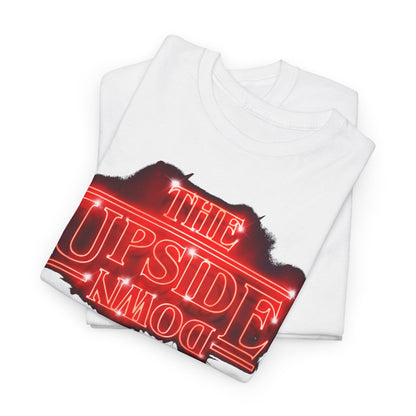 Elegant display of a folded white T-shirt showcasing 'THE UPSIDE DOWN' neon-red graphic, ideal for fans of retro aesthetics.