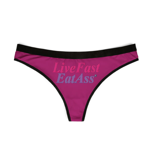 Elegant purple thong underwear showcasing the vibrant 'Live Fast, Eat Ass' typography, perfect for adding a sassy touch to your lingerie collection.