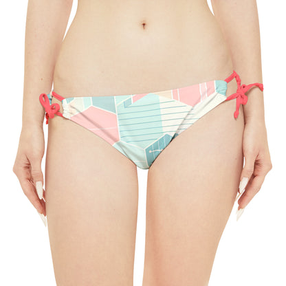 Luxurious Sweat Symphony Loop Tie Side Bikini Bottom by Dazzling Dreams Studio, featuring adjustable elastic straps and a stylish low-rise cut.