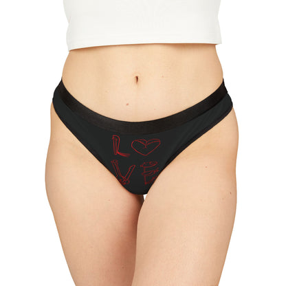 Luxury women's black thong featuring a playful 'LOVE' graphic design in striking red, perfect for adding a cheeky twist to intimate apparel.