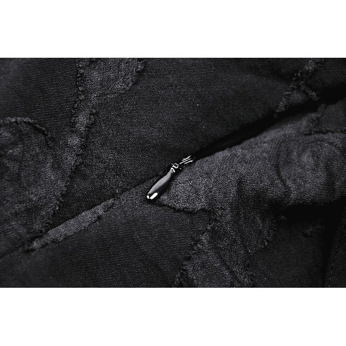 Close-up of the Dark in Love Zemira Dress highlighting the unique bat wing effect and luxurious plunging neckline, ideal for contemporary style enthusiasts.