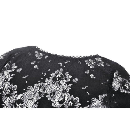 Close-up of the luxurious floral pattern on the Emersyn lace-trimmed robe, showcasing the exquisite craftsmanship and delicate details.