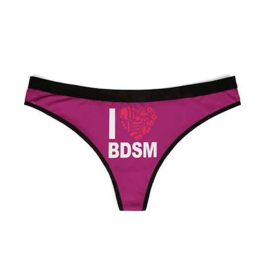 Luxurious women's thong featuring a bold 'I ♥ BDSM' print on a vibrant pink background, perfect for playful romantic occasions.