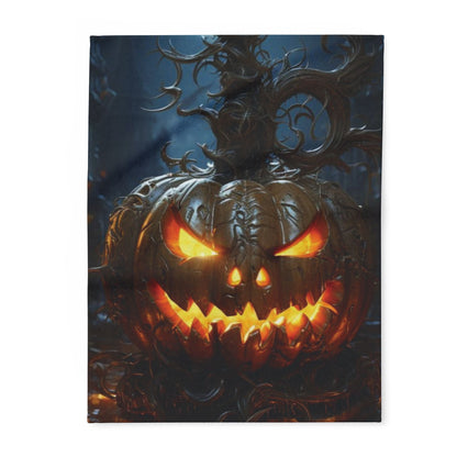 Luxurious Decorative and Warm Halloween Spooky Arctic Fleece Blanket featuring a menacing jack-o'-lantern with glowing eyes, perfect for creating an eerie atmosphere this Halloween.