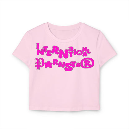 Delightful pink women's crop t-shirt highlighting the trendy 'International Parnstar' phrase in vibrant pink typography, a playful addition to any luxury wardrobe.