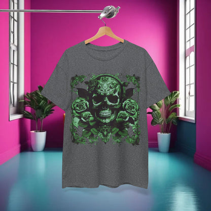 The Skulls and Roses Cotton Tee displayed elegantly on a hanger against a vibrant pink backdrop, highlighting the unique green skull and rose design.