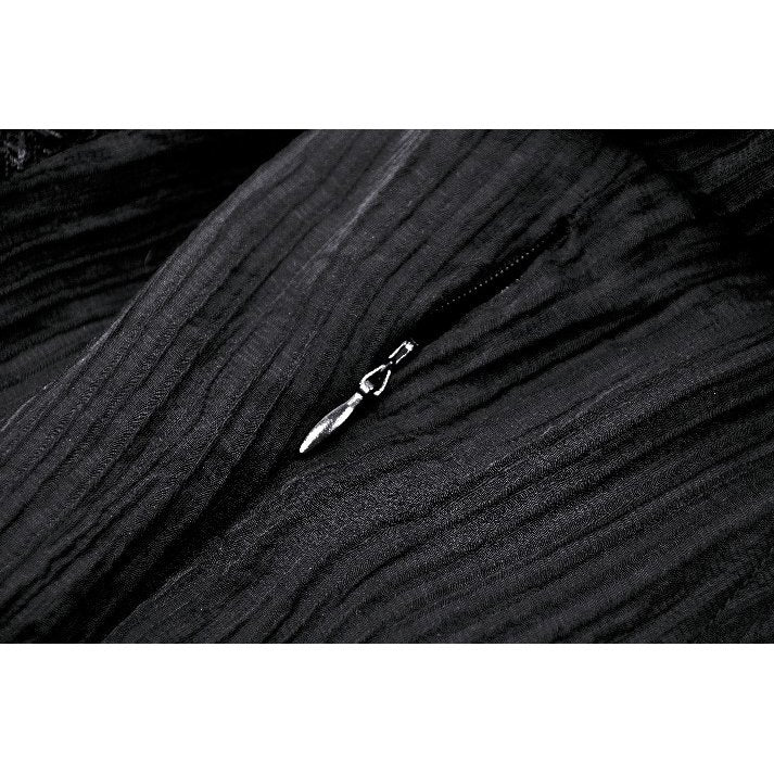 Model wearing the Dark in Love Harlow Gothic Lace Maxi Dress in a mystical setting, showcasing its captivating elegance and alluring gothic aesthetic.