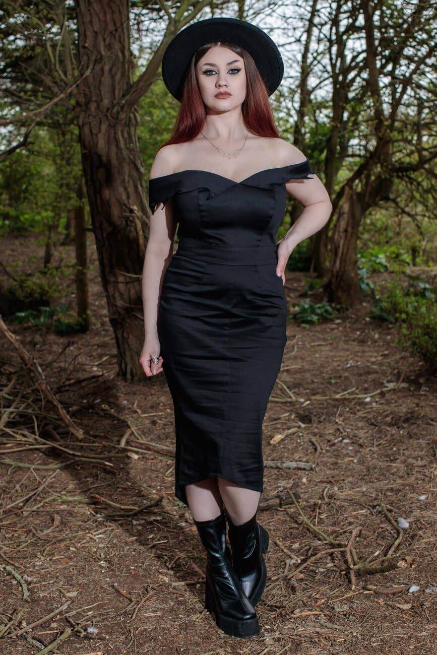 Elegant off-shoulder midi dress in organic cotton-sateen featuring intricate bat motif, perfect for gothic glam style.