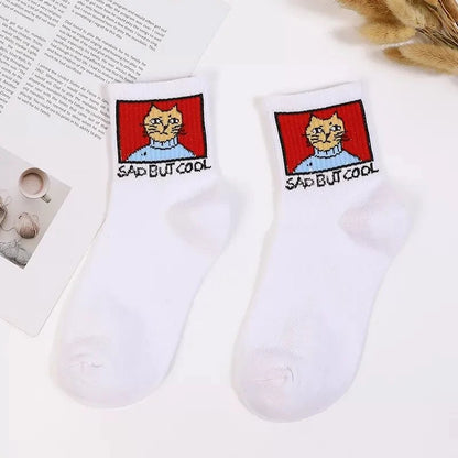 Stylish Hip Hop Long Socks for Women & Girls featuring a whimsical cartoon cat design that says 'SAD BUT COOL' on a white background, crafted from a luxurious cotton and polyester blend for ultimate comfort.