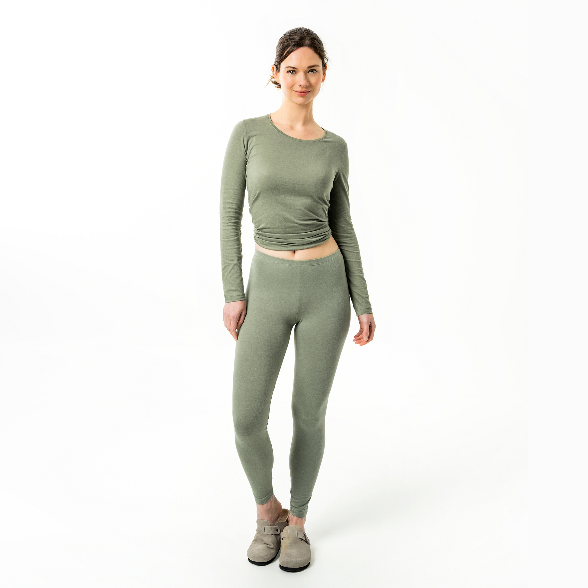 Luxurious high-rise organic cotton stretch leggings for women, showcasing a slim-fit silhouette and double seam hems for enhanced durability, epitomising comfort and style.