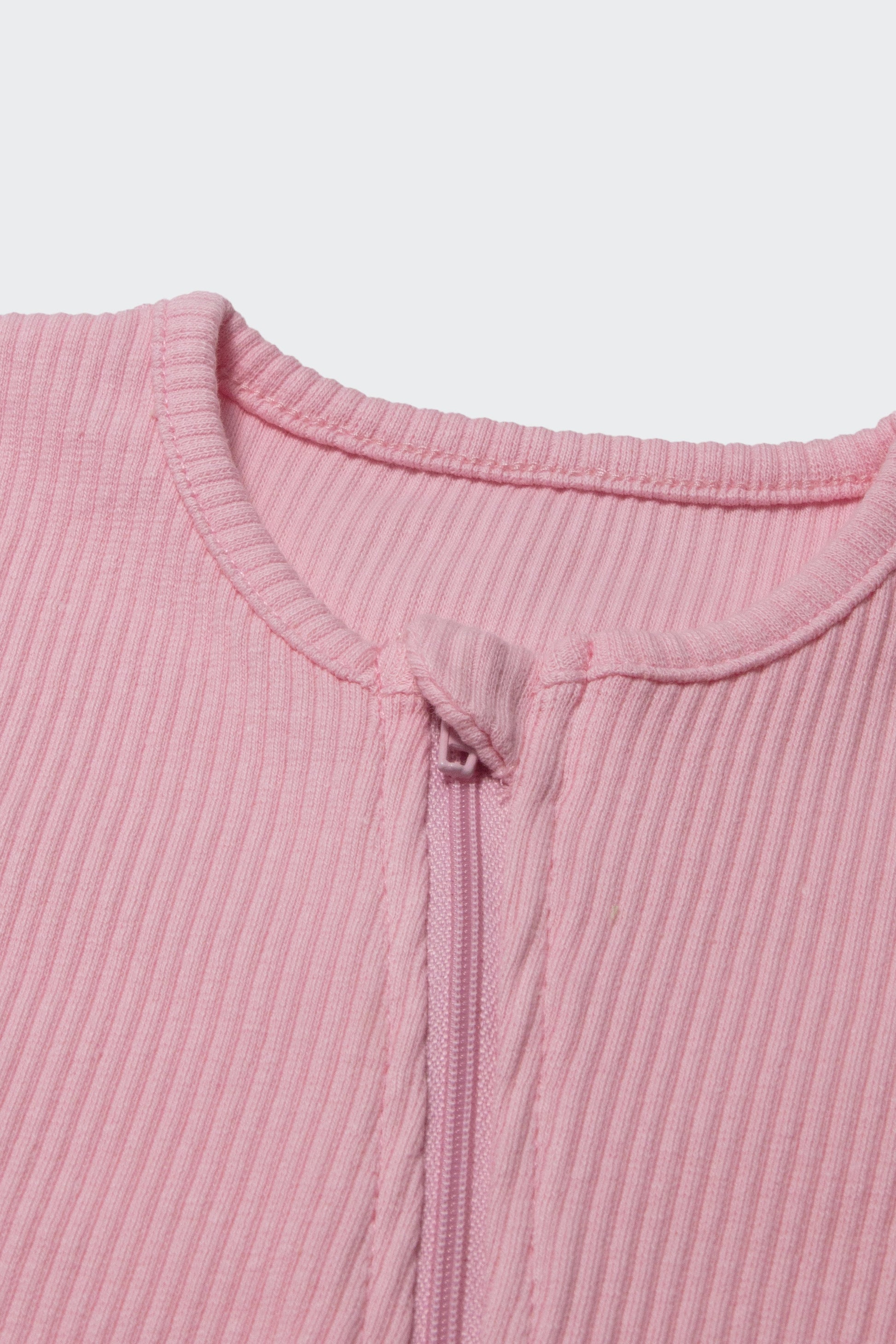 DreamBuy Sweet Pink Zip Sleepsuit for infants aged 0-3 years, perfect for sensitive skin, presented in a luxurious design.