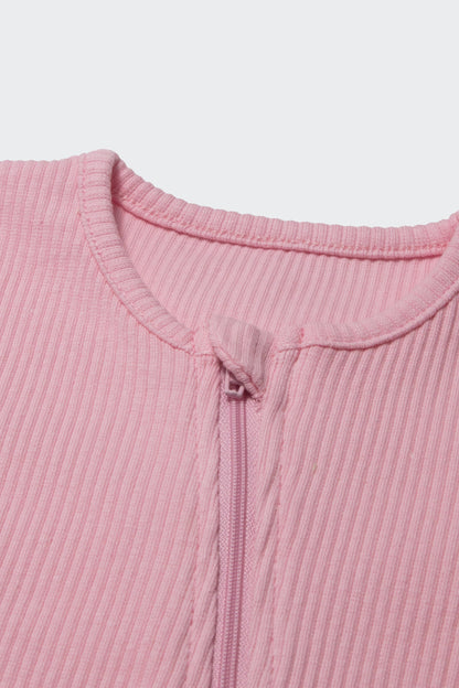 DreamBuy Sweet Pink Zip Sleepsuit for infants aged 0-3 years, perfect for sensitive skin, presented in a luxurious design.