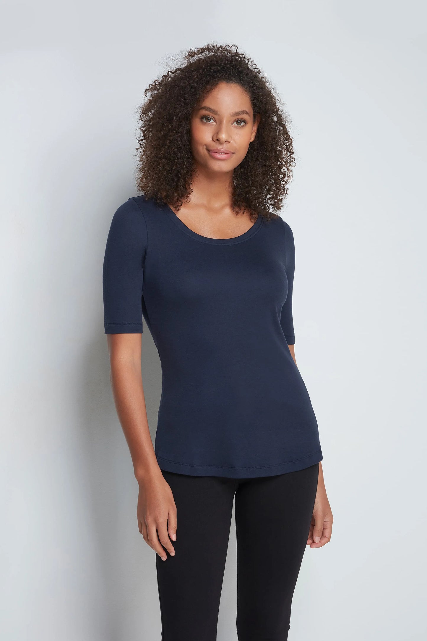 Elegant women’s t-shirt styled in a casual outfit, perfect for layering or wearing alone for versatile fashion.