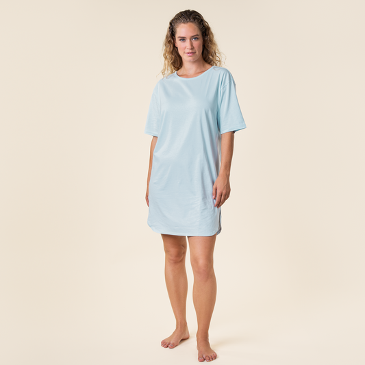 Luxurious mid-length night shirt for women, crafted from soft organic cotton, offering ultimate comfort and elegance for a restful night's sleep.