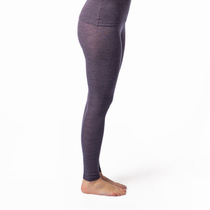 Stylish woman wearing luxurious wool and organic cotton leggings, providing natural insulation and moisture regulation for ultimate comfort.