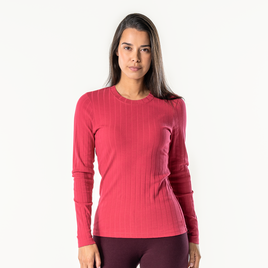 Elegantly styled organic cotton ribbed long sleeve T-shirt for women showcasing a slim fit, gentle stretch and ideal for versatile layering.