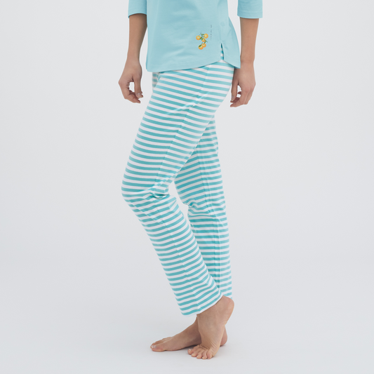 Luxury organic cotton sleep leggings for women featuring an elegant design with decorative mother-of-pearl buttons and a comfortable wide elasticated waistband.