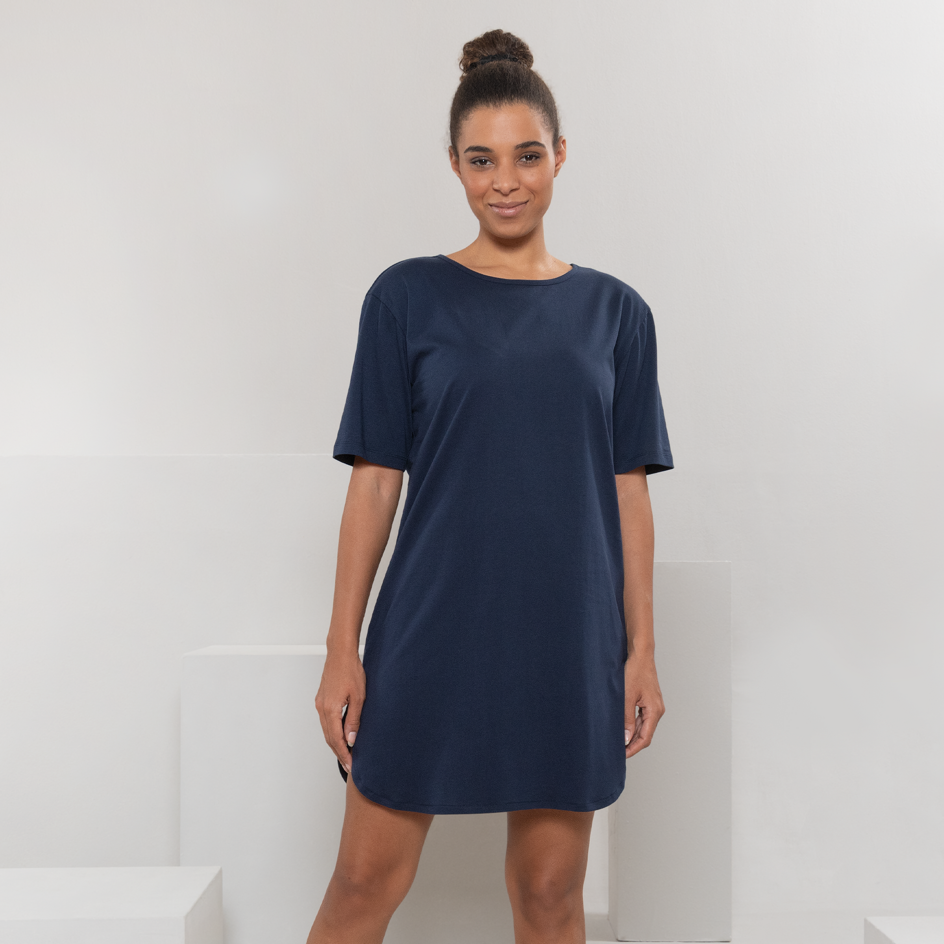 Model wearing the organic cotton midi night shirt, illustrating its perfect fit and elegant drape, ideal for a restful night's sleep.