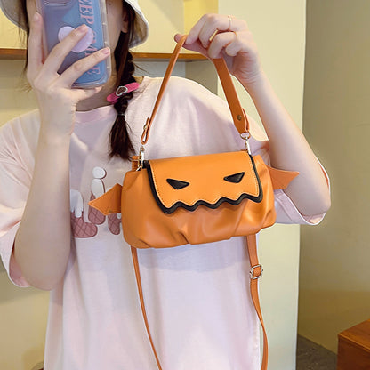 Versatile PU Crossbody Bags for Women - Trendy Orange & Black Halloween Style, displayed on a model in a pink T-shirt with a bucket hat, holding the bag.