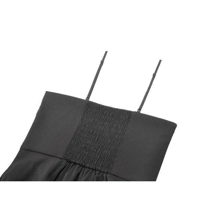 Stylish model showcasing the Dark in Love Nyssa Mini Dress with heart buckle and red tie-dye underskirt, perfect for gothic fashion enthusiasts.