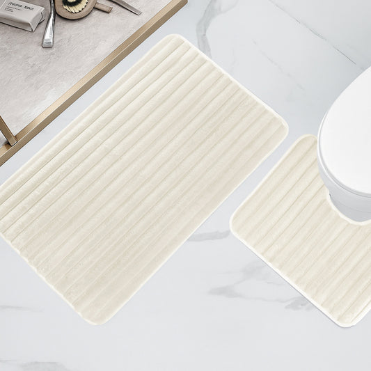 Super absorbent and quick-drying cream bath mat, featuring a non-slip backing for added safety and comfort in the bathroom.