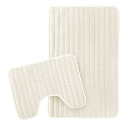 Elegant cream ribbed bath mat showcasing plush texture and modern design, perfect for luxurious bathroom decor.