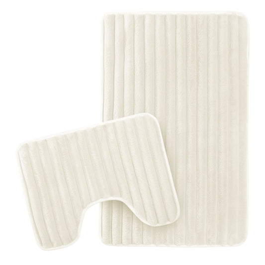 Elegant cream ribbed bath mat showcasing plush texture and modern design, perfect for luxurious bathroom decor.