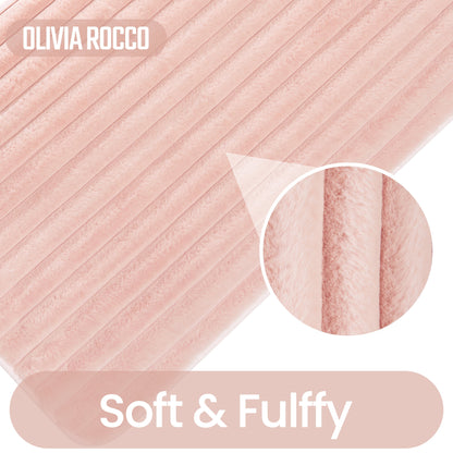 Chic pink 2 piece ribbed bath mat set by OLIVIA ROCCO, showcasing luxurious softness and modern elegance for a stylish bathroom decor.