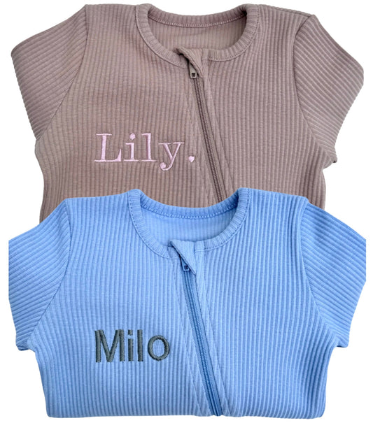 Luxurious Powder Blue Zip Sleepsuit for Babies by DreamBuy, crafted from soft ribbed cotton, suitable for ages 0-36 months, offering sublime comfort and elegant style.