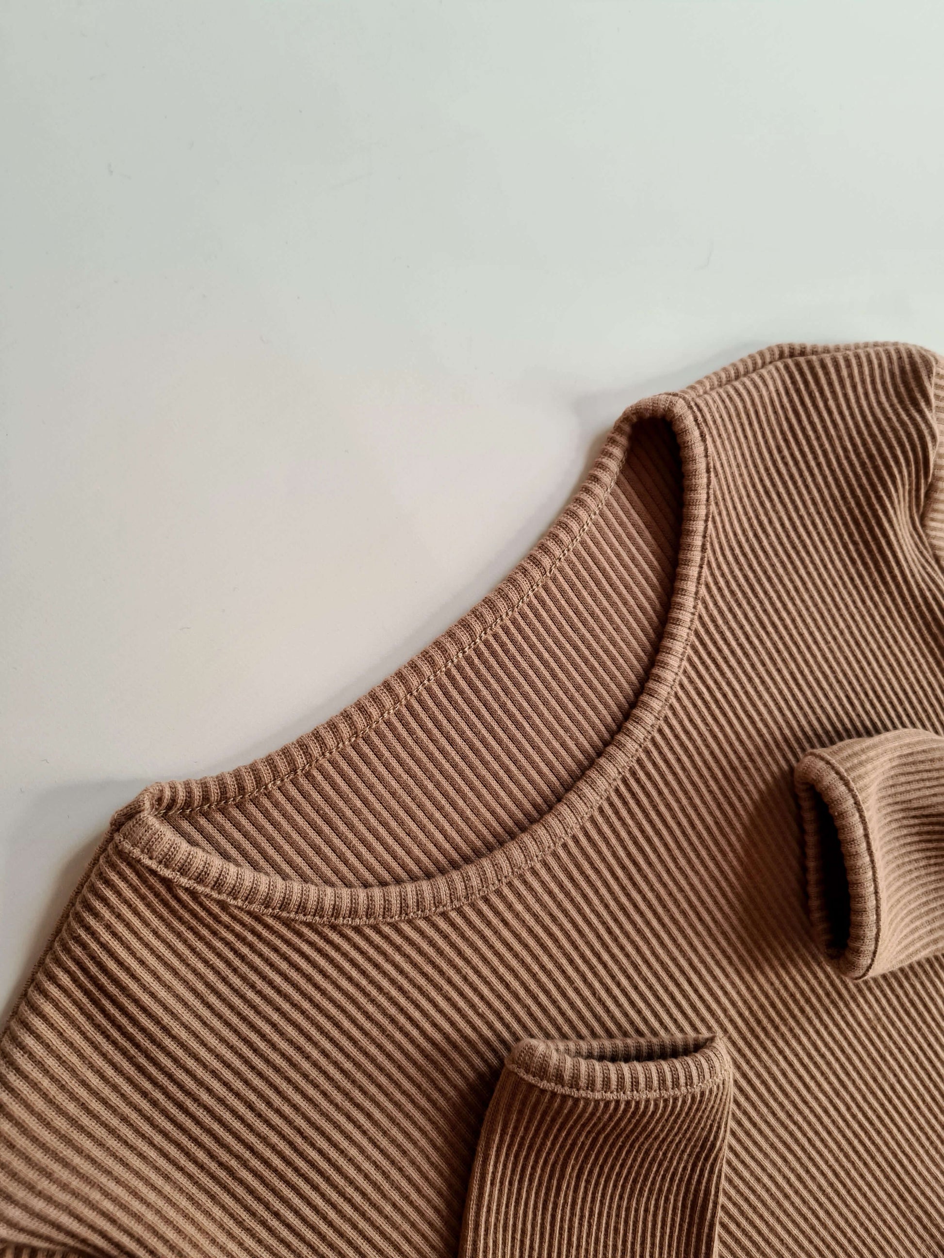 Elegant DreamBuy Biscuit colour pyjamas set showcasing a minimalist design with long-sleeve blouse and drawstring pants, ideal for festive gatherings and family lounging.