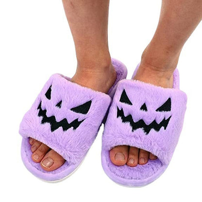 Halloween Shoes Winter Cute Warm Home Slippers Women - Trendy purple pumpkin-faced slippers worn on feet, embodying comfort and festive luxury.