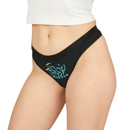 Stylish black thong panties showcased on a model, adorned with the playful phrase 'Good Girl' in a retro font, ideal for confident women wanting to express their unique style.