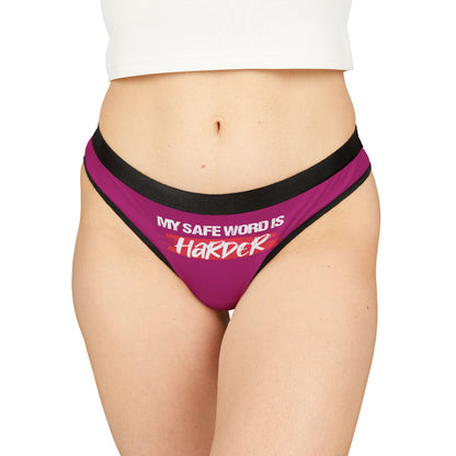 Elegant cheeky women's thong featuring the bold phrase 'MY SAFE WORD IS HARDER' on a vibrant pink background, designed for playful intimacy.
