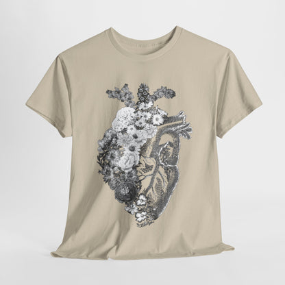 Elegant graphic t-shirt featuring a vintage anatomical heart intertwined with delicate flowers, depicted in shades of grey against a soft beige fabric. Perfect for making a unique fashion statement with an artistic flair, embodying the beauty of life’s contrasts.