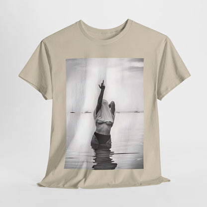 Middle Finger Girl Graphic T-Shirt Urban Unisex Cotton Tee in soft beige, showcasing a striking black and white image of a defiant woman standing in tranquil waters.