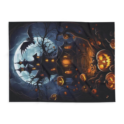 Decorative and Warm Halloween Spooky Arctic Fleece Blanket featuring an enchanting design of a haunted scene with glowing pumpkins and a full moon, perfect for seasonal decor.