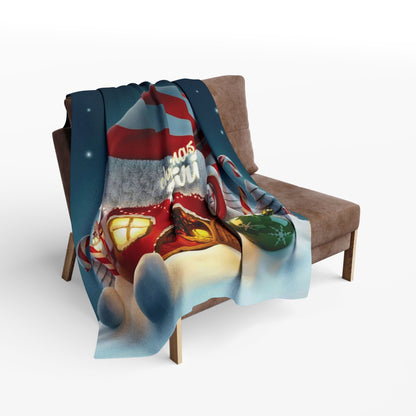 Decorative and Warm Christmas Arctic Fleece Blanket draped on a stylish armchair, illustrating its vibrant holiday design with snowflakes and a gingerbread house, ideal for cozy winter aesthetics.