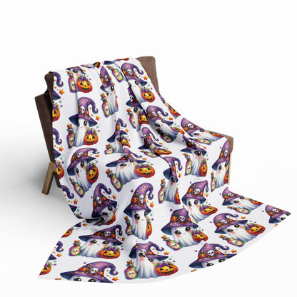 Decorative and Warm Halloween Cute Arctic Fleece Blanket elegantly presented on a chair, adorned with charming ghost and pumpkin illustrations, perfect for Halloween celebrations.