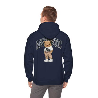 Chic navy hoodie worn by a model, featuring a captivating cartoon teddy bear design on the back, complemented by the word 'AESTHETIC,' merging comfort with modern style.