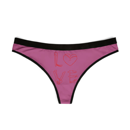 Stylish women's thong displaying a vibrant pink background with a cheeky love-themed graphic, ideal for adding a humorous touch to romantic occasions.