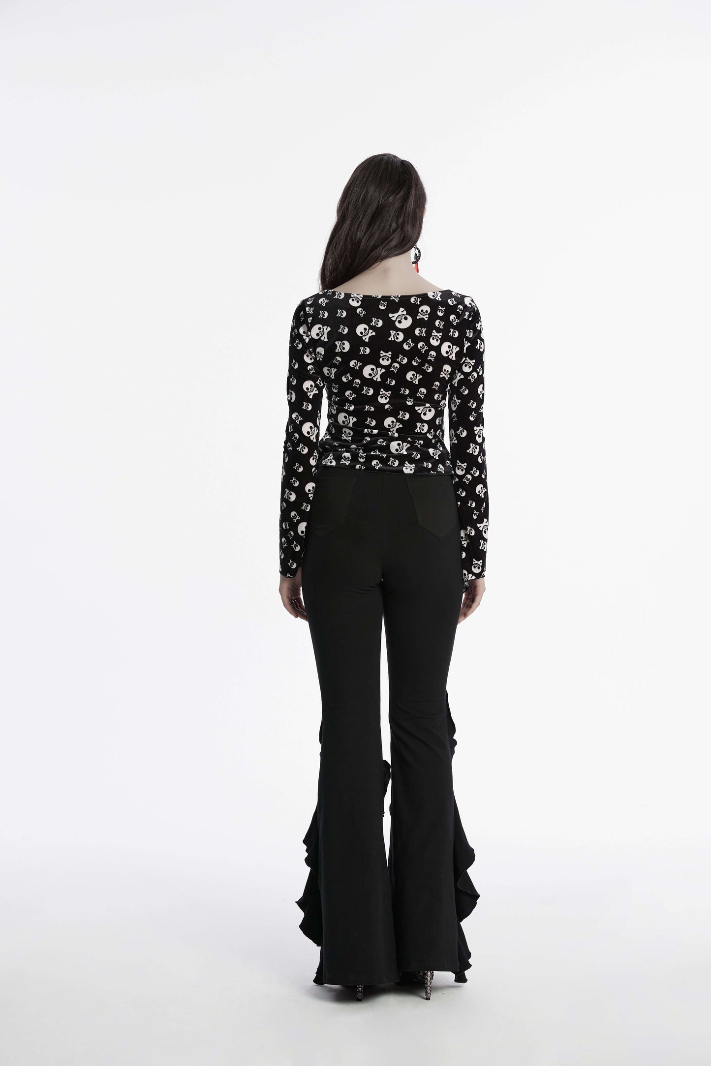 Punk Rave Veda Flared Pants displayed on a beautiful hanger, emphasising the luxurious texture and edgy aesthetic perfect for fashion-forward individuals.