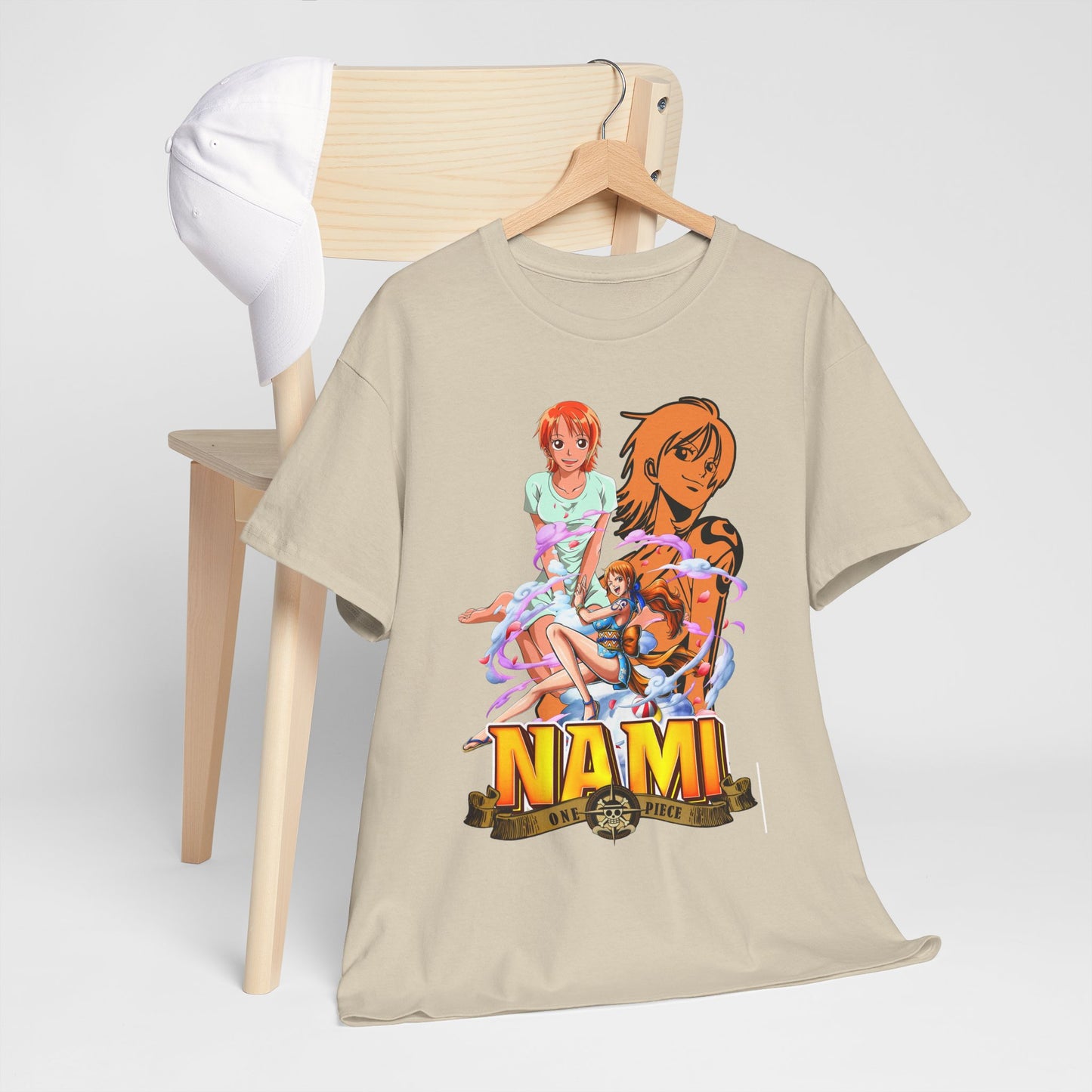 Stylish beige men's t-shirt adorned with vibrant Nami anime graphics, showcased beside a chic white cap on a wooden chair.