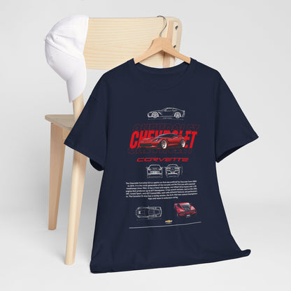 Sophisticated navy blue Chevrolet Corvette C6 graphic T-shirt laid on a wooden chair beside a stylish white cap, highlighting the iconic car design and premium fabric.