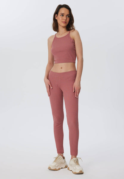 Elegant organic cotton ribbed leggings for women featuring a soft elasticated waist, perfect for a chic casual look.