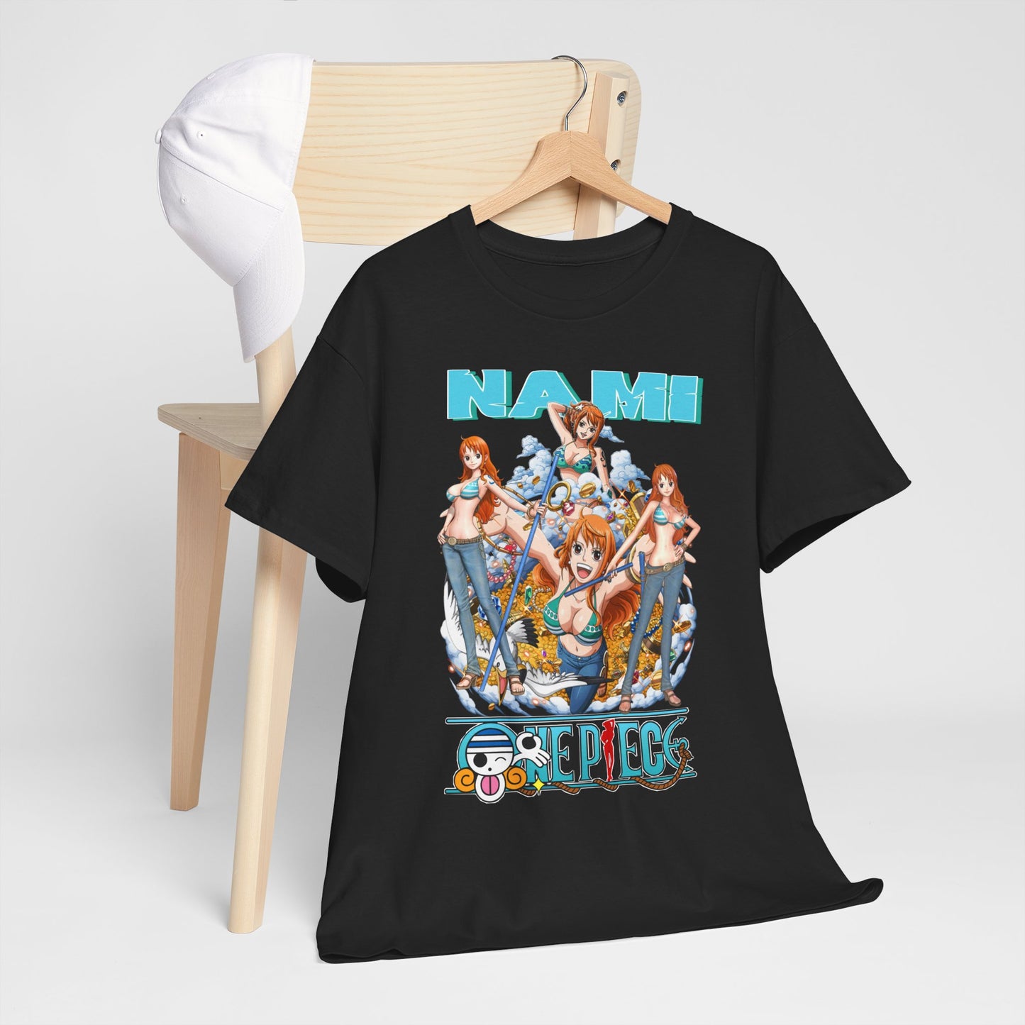 Chic black t-shirt displayed on a minimalist chair next to a white cap, featuring a vibrant Nami graphic from One Piece, encapsulating adventure and style for anime aficionados.