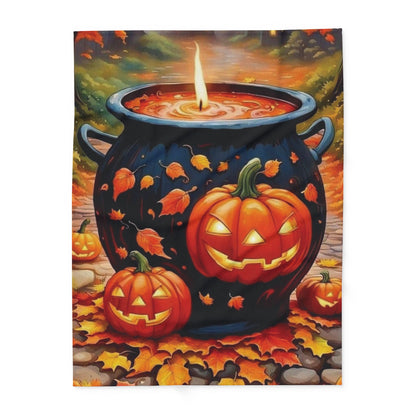 Chic Decorative and Warm Halloween Spooky Arctic Fleece Blanket with a captivating design of pumpkins and a magical cauldron amidst colourful fall leaves.