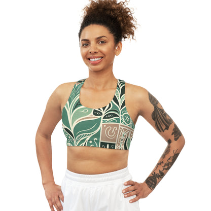 A model wearing the Thea Sinclair Pastel Green Sports Bra, beautifully designed with a modern block print, demonstrating style and support in an active setting.