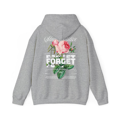Sophisticated grey hoodie showcasing a vibrant floral backdrop alongside the phrases 'Stay Positive' and 'Forget Your Problems,' combining comfort with elegance.