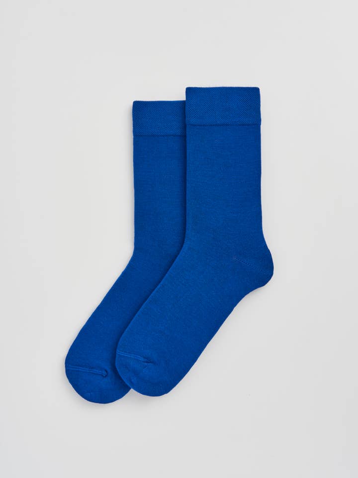 Elegant display of Luxury Bamboo calf-length socks in various stylish colours, designed for comfort and sophistication.