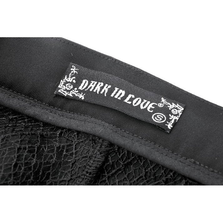 Model pairing Dark In Love Convertible Goth Trousers with chunky boots and witchy accessories, embodying a dark chic street style.